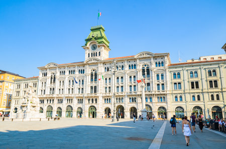 Trieste, Italy - 05.08.2015 : View of Trieste City Hall building in Itally with tourists passing by. Travel destination.のeditorial素材