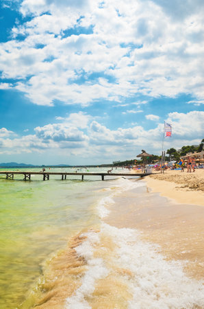 Alcudia, Spain 14.09.2011 - People sunbathing at sandy beach of Playa de Muro. Mallorca island famous tourist destination.のeditorial素材