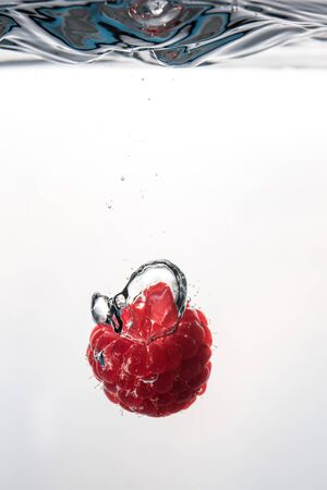 Raspberry falling into a water