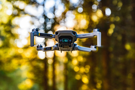 Graz, Austria: 02.01.2020 - Close up shoot of a DJI Quadcopter Drone Mavic mini 249g. Drone flying...