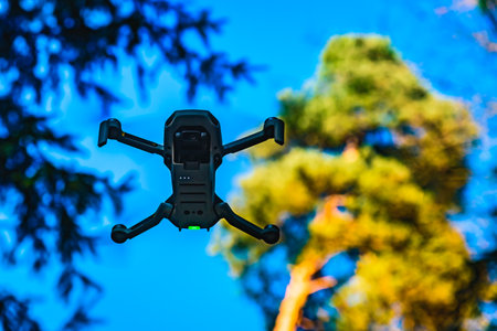 Graz, Austria: 02.01.2020 - Close up shoot of a DJI Quadcopter Drone Mavic mini 249g. Drone flying...
