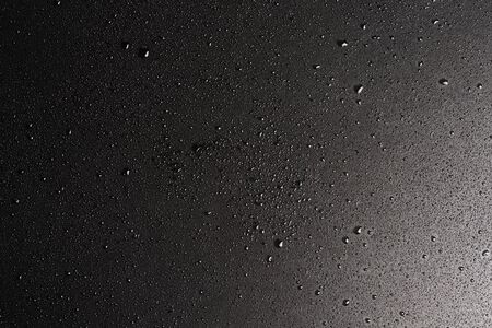 Abstract black texture for background. Blackboard covered with water drops, tabletop copy spaceの写真素材