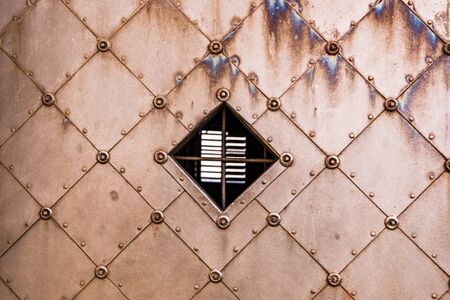 Medieaval pattern on an old metal door.の写真素材