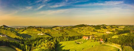 South styria vineyards aerial panorama landscape, near Gamlitz, Austria, Eckberg, Europe. Grape hills view from wine road in spring. Tourist destination, travel spot.の写真素材