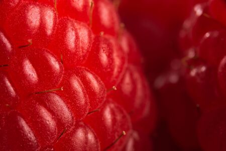 Ripe raspberry isolated on black background close up macro shoot