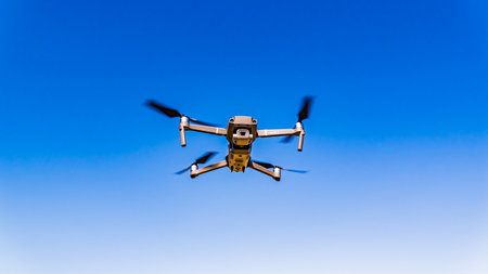 Graz, Austria 15.03.2020 - DJI Drone Mavic 2 Pro with Hasselblad camera flying against blue sky....