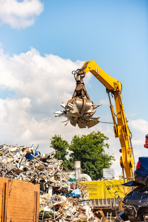 Close-up of a crane for recycling metallic waste on scrapyardのeditorial素材