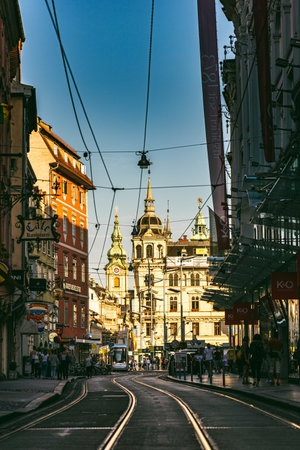 Graz, Austria -13.07.2020 Tram and people on Herrengasse Street in Downtown and Old city of Graz in Austria. Town in Styria in Europe. Travel and history with architecture.のeditorial素材