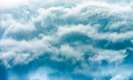 Dramatic stormy clouds, close up view on a fluffy cumulus before storm. Background panoramaの写真素材