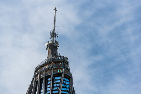 Lake Worth, Austria - 26.08.2020: The Pyramidenkogel wooden observation tower with view over lake. Tourists with masks durring corona virus pandemic.のeditorial素材