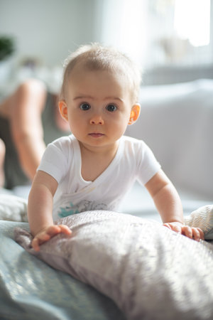 Baby lifting herself from belly up.