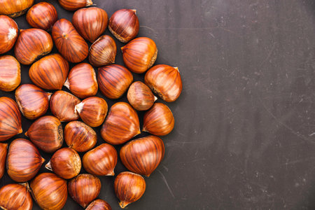 Ripe chestnuts close up. Raw Chestnuts for Christmas. Fresh sweet chestnut.の写真素材
