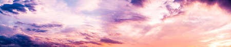 Dark blue sunset sky pano with Cumulus clouds.
