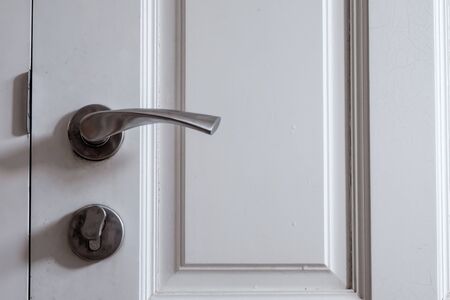 A aluminum door knob with aluminum door lock, both were attached to the doorの写真素材