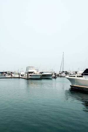 Group of various luxury yachts and fishing boats parked at pier near Nelson Bay of New South Wales, Australiaの写真素材