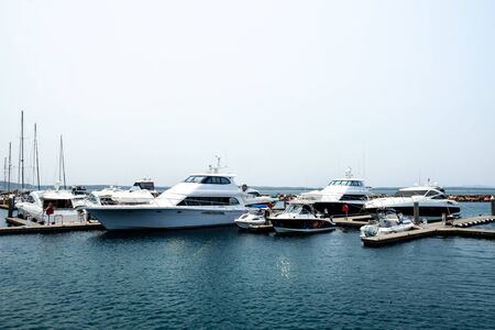 Group of various luxury yachts and fishing boats parked at pier near Nelson Bay of New South Wales,...
