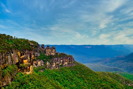 Beautiful panoramic landscape shot of the Three's sister rock cliff from Echo Point at Blue Mountain National Park in New South Wales, Australiaの写真素材