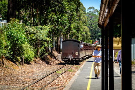 Melbourne. Australia - January 02, 2020: The passenger and tourist leaving the traditional famous classic Puffing's Billy steam trainのeditorial素材