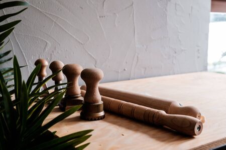 A set of pasta creating tools, including rolling pins and metal molds for cutting, stamping pasta...