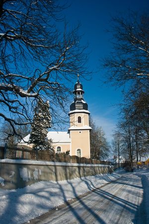 Little chapel in the snow in Landwuest Saxony Germanyの写真素材