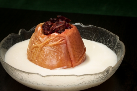 Roasted Apple with vanilla sauce and granberrysの写真素材