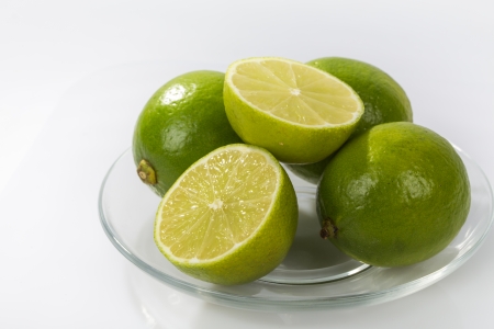 Fresh Limes isolated on a white の写真素材