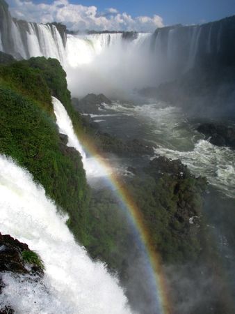 IGUAZU WATER FALLS, with a rainbow following down the water. Brasilの写真素材