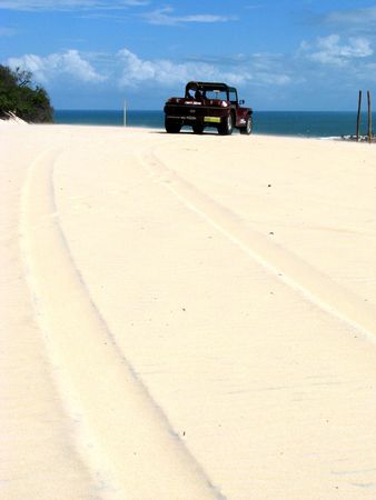 Buggy running through the giant sand dunes of Genipabu (Natal), north-eastern Brazil.の写真素材