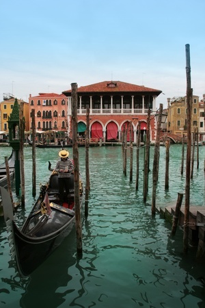 Venice: Traditional gondola waiting for a romantic ride, near Canal Grande and Rialto bridge.の写真素材