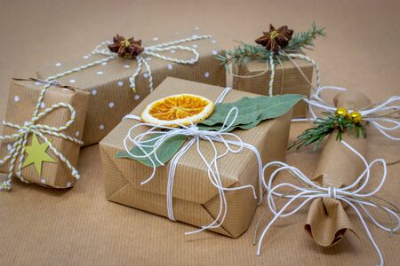 Christmas packages of wrapping paper tied with white stringの写真素材