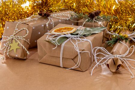 Christmas packages of wrapping paper tied with white stringの写真素材