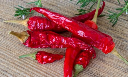 red chillies on a wooden background