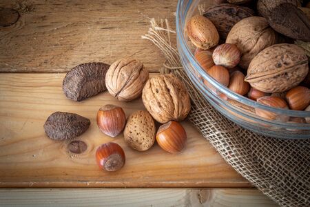 dried fruit in a glass bowl on a wooden table