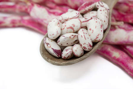 pinto beans on wooden spoonの写真素材