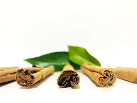 Fragrant cinnamon sticks on a white background