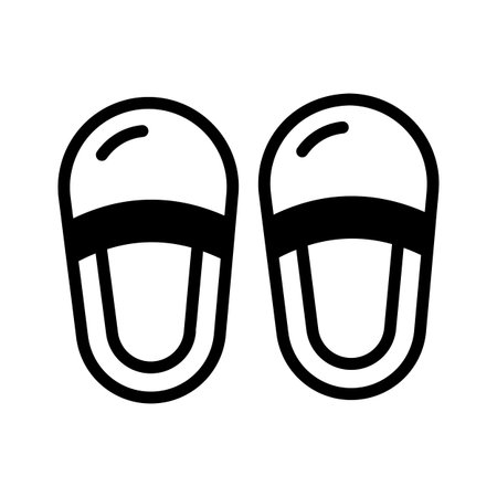 Trendy glyph style icon of soft home slippers pairのイラスト素材