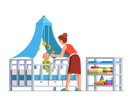 Mother playing rattle to little baby son toddler sitting in crib bed or cot.  Flat cartoon vector illustration.のイラスト素材