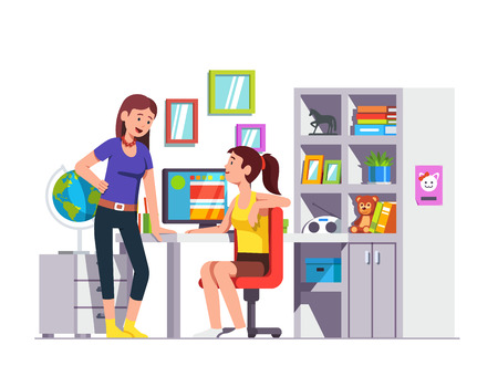 Two school student friends talking, doing homeworkの写真素材