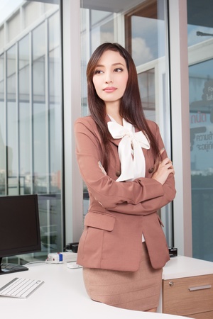 Confident young businesswoman in the roomの写真素材