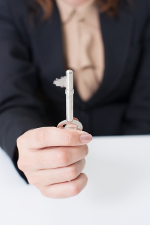 Businesswoman with key of successの写真素材