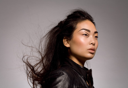 Asian model wearing biker jacket.の写真素材