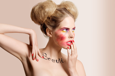 Fashion model with French word "beauty" written on her neck.の写真素材