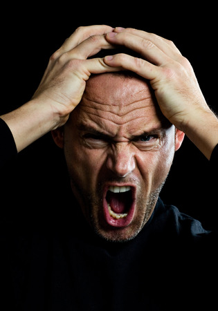 Screaming man in black.の写真素材