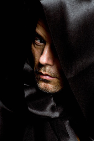 Monk in black hood.の写真素材