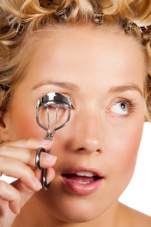 Girl curling lashes series.の写真素材