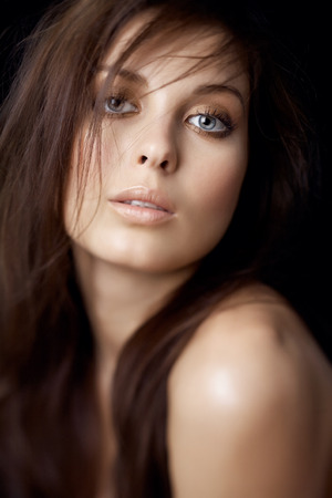 Portrait series of a Caucasian woman on black background. Shot with defocused effect.の写真素材