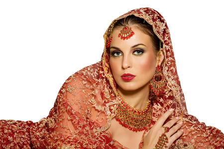 Indian woman wearing traditional red outfit.