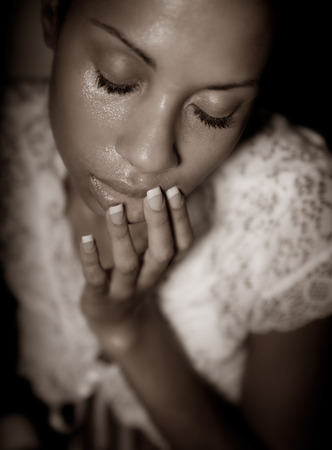 Sepia image of a contemplating African woman.の写真素材