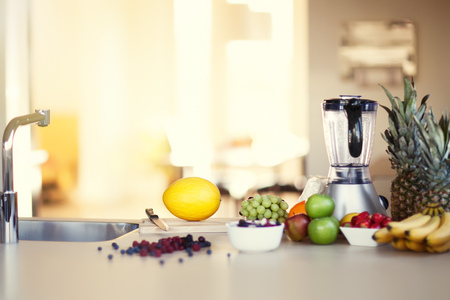 Ingredients for making smoothie in sunny kitchen. Variety of berries and fruit.の写真素材