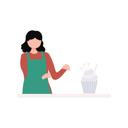 A girl is baking a muffin.のイラスト素材